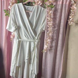 Gorgeous white summer dress. Perfect for that all white party or brunch
